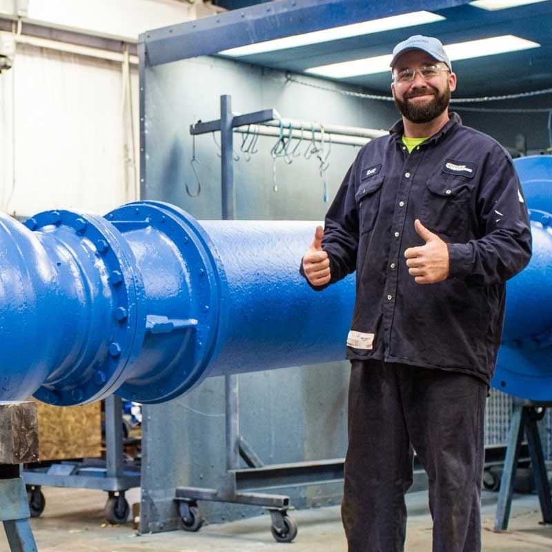 Man-standing-in-front-of-pump