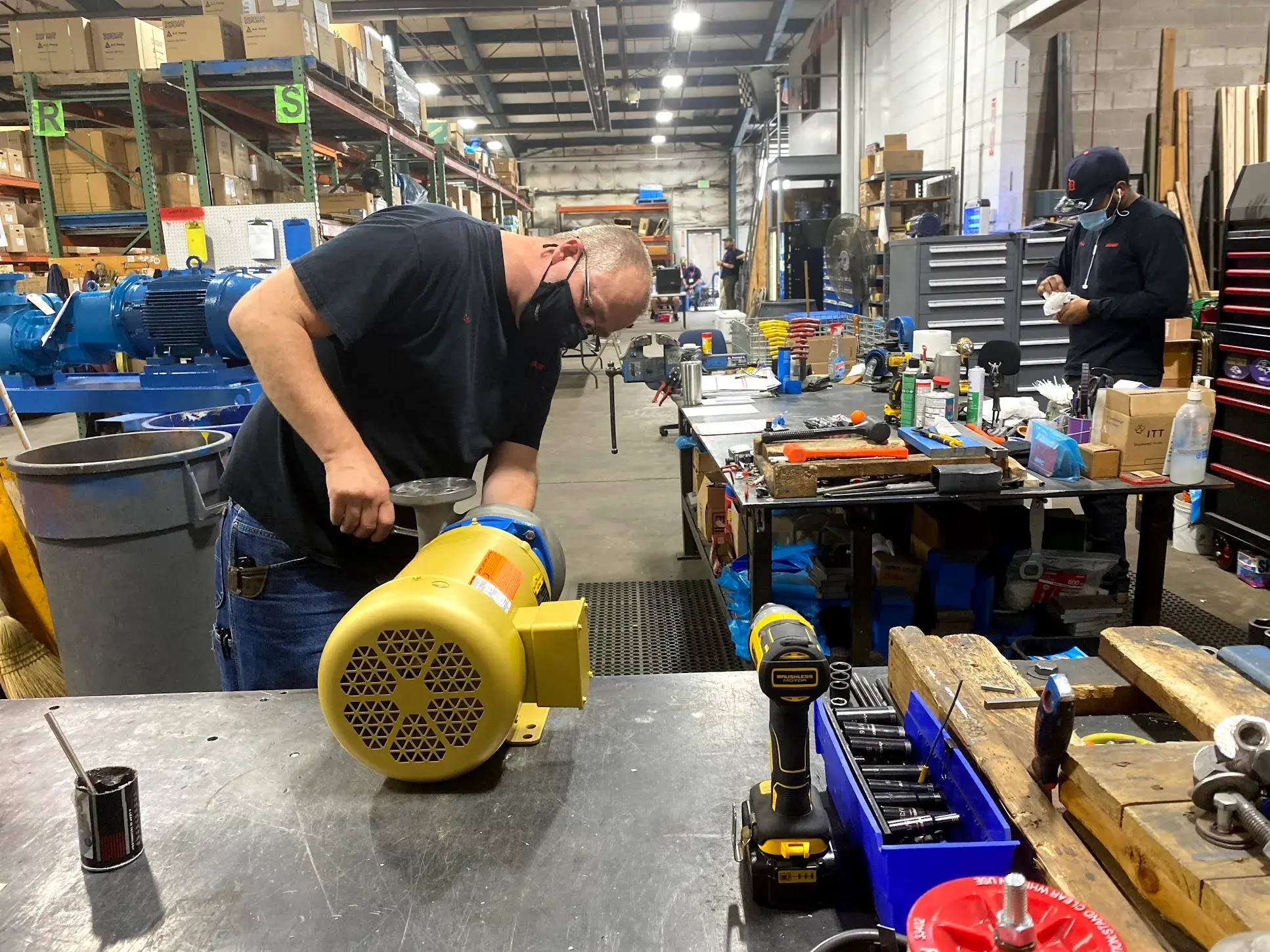 Geiger Service Technician repairing a yellow pump