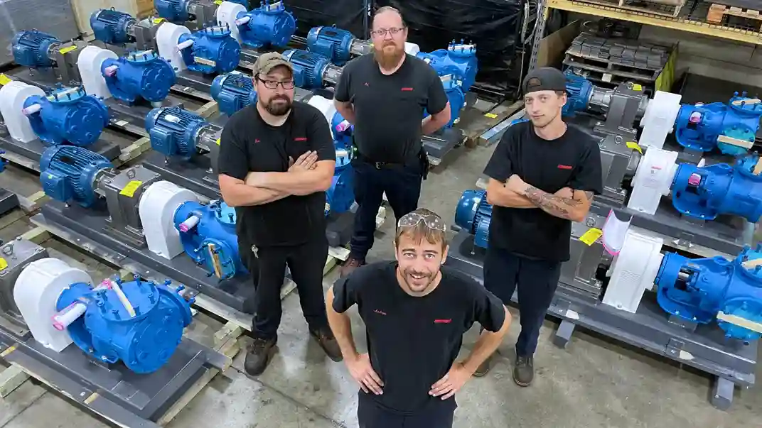Geiger Team in front of multiple pumps